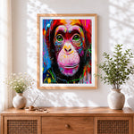 Finished graffiti style chimpanzee portrait cross stitch artwork displayed