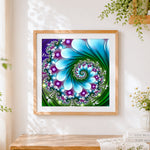 Finished green abstract spiral kaleidoscope cross stitch artwork displayed