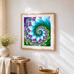 Green abstract spiral kaleidoscope cross stitch artwork displayed on wall as home decor