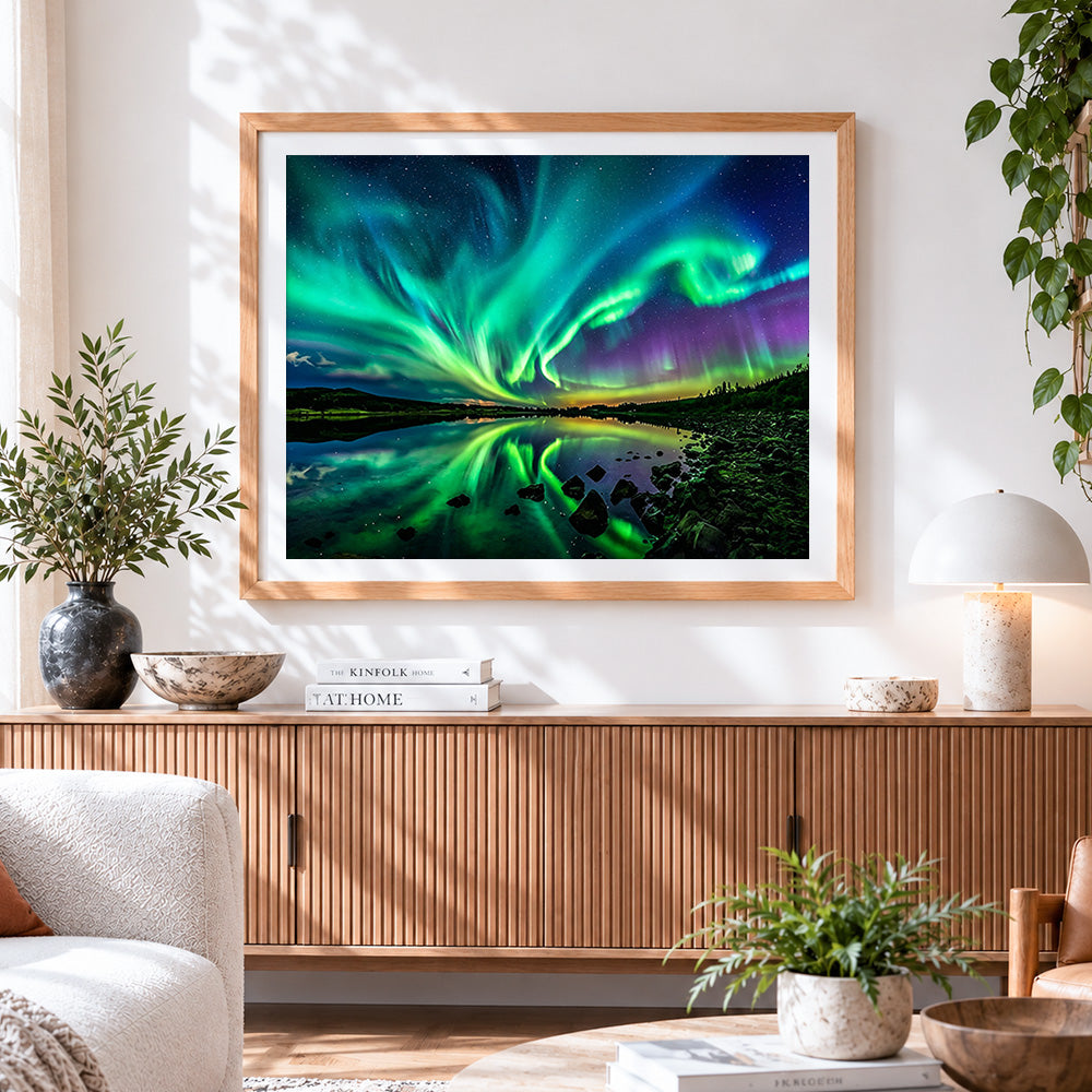 Finished green aurora reflected in a lake cross stitch artwork displayed