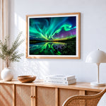 Green aurora reflected in a lake cross stitch artwork displayed on wall as home decor