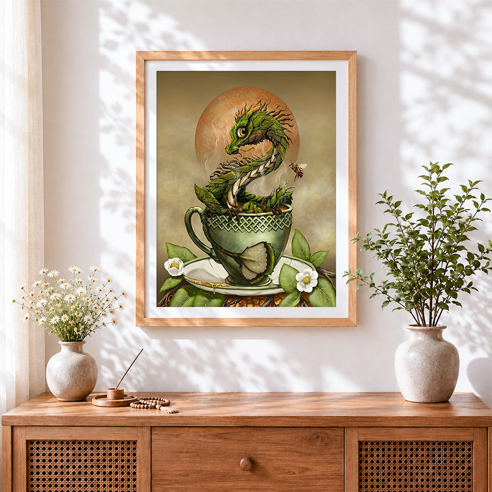 Finished green dragon in teacup cross stitch artwork displayed