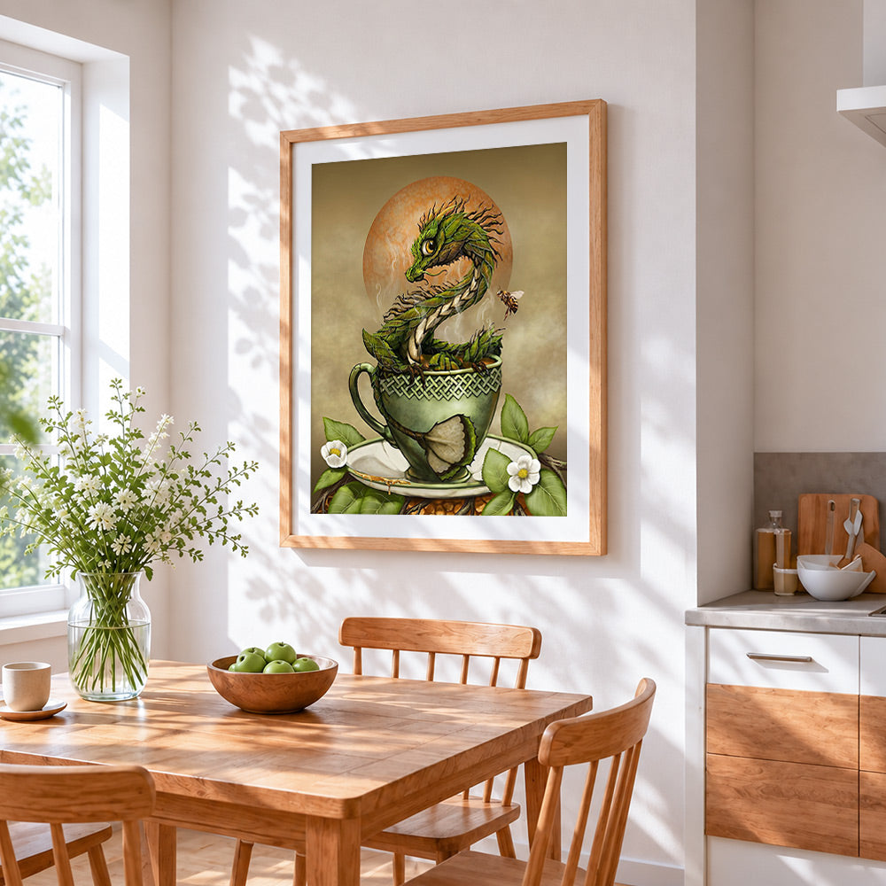 Green dragon in teacup cross stitch artwork displayed on wall as home decor
