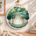 Green forest path embroidery hoop wall art displayed as warm and cosy handmade home decor