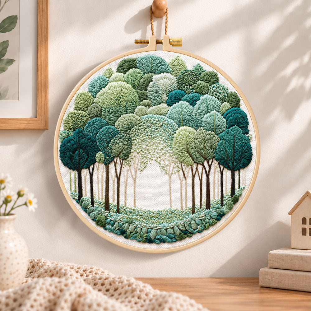 Green forest path embroidery hoop wall art displayed as warm and cosy handmade home decor