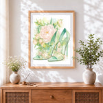 Finished green heels and peonies cross stitch artwork displayed