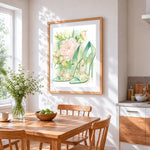 Green heels and peonies cross stitch artwork displayed on wall as home decor