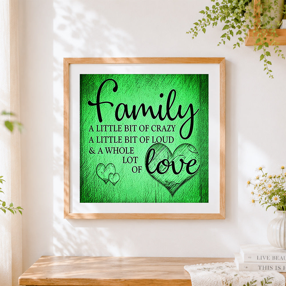 Finished green texture family and love quote cross stitch artwork displayed