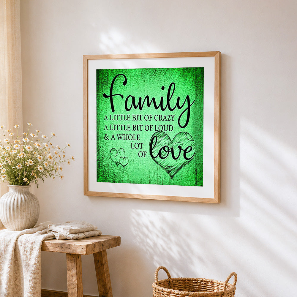 Green texture family and love quote cross stitch artwork displayed on wall as home decor
