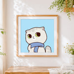 Finished grey cat with blue scarf cross stitch artwork displayed