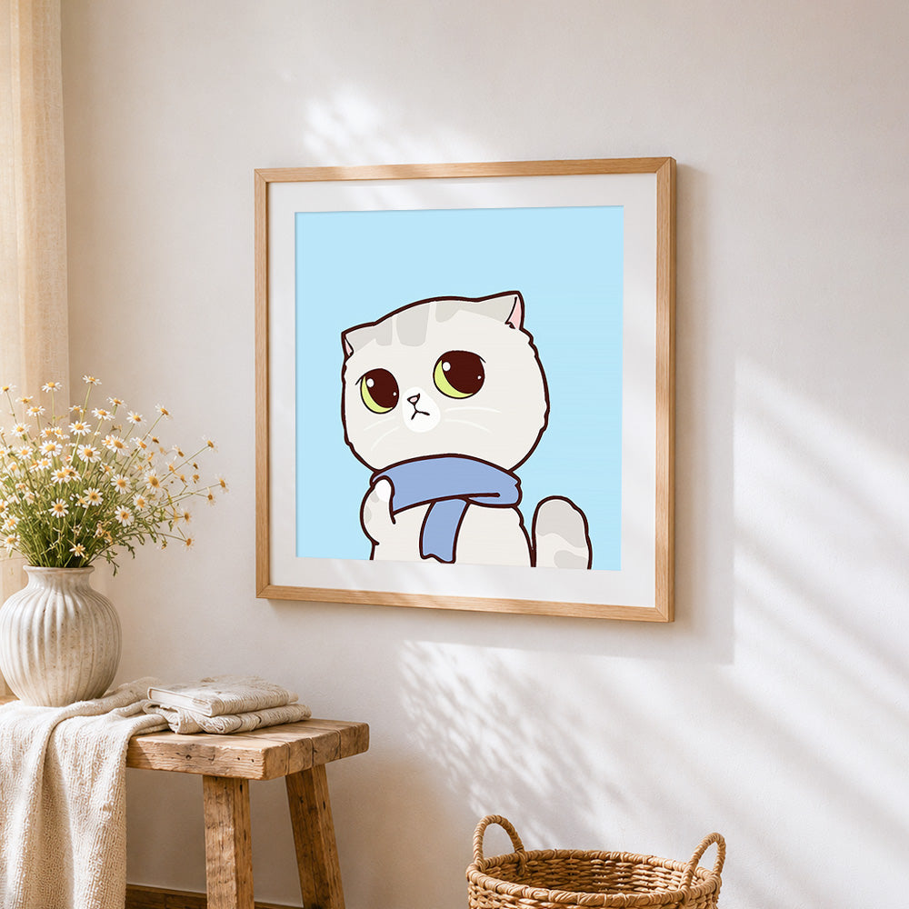 Grey cat with blue scarf cross stitch artwork displayed on wall as home decor