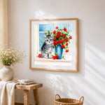 Grey kitten with red roses cross stitch artwork displayed on wall as home decor