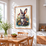 Grey rabbit in a wildflower meadow cross stitch artwork displayed on wall as home decor