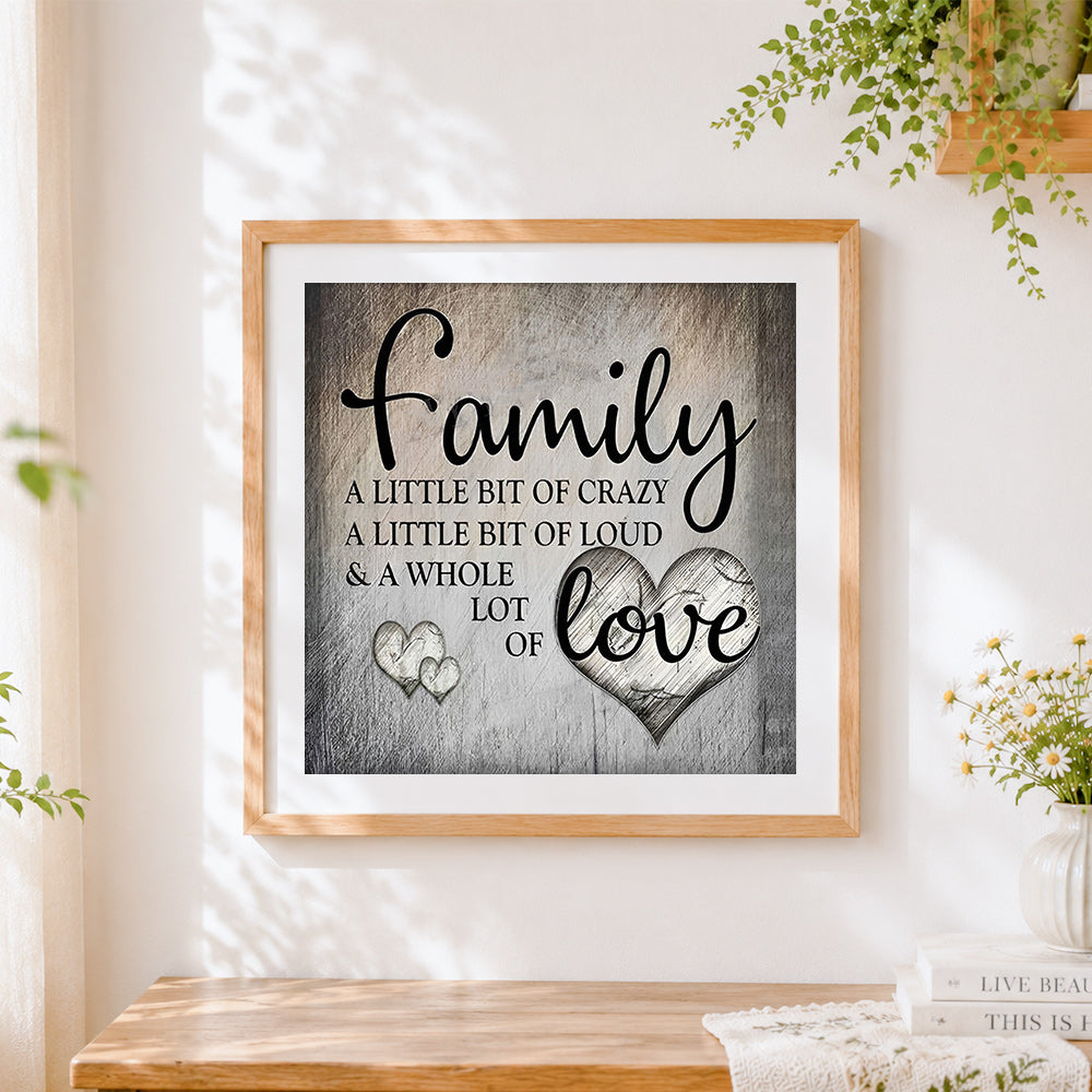 Finished grey texture family quote cross stitch artwork displayed