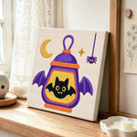 Halloween bat lantern punch needle artwork displayed on a table