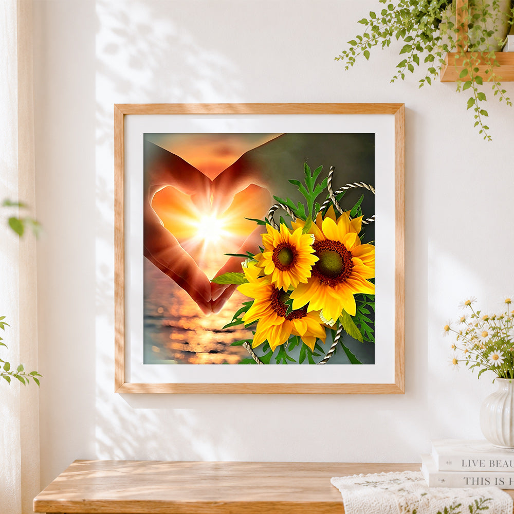 Finished hands making a heart with sunflowers paint by numbers artwork displayed as home decor