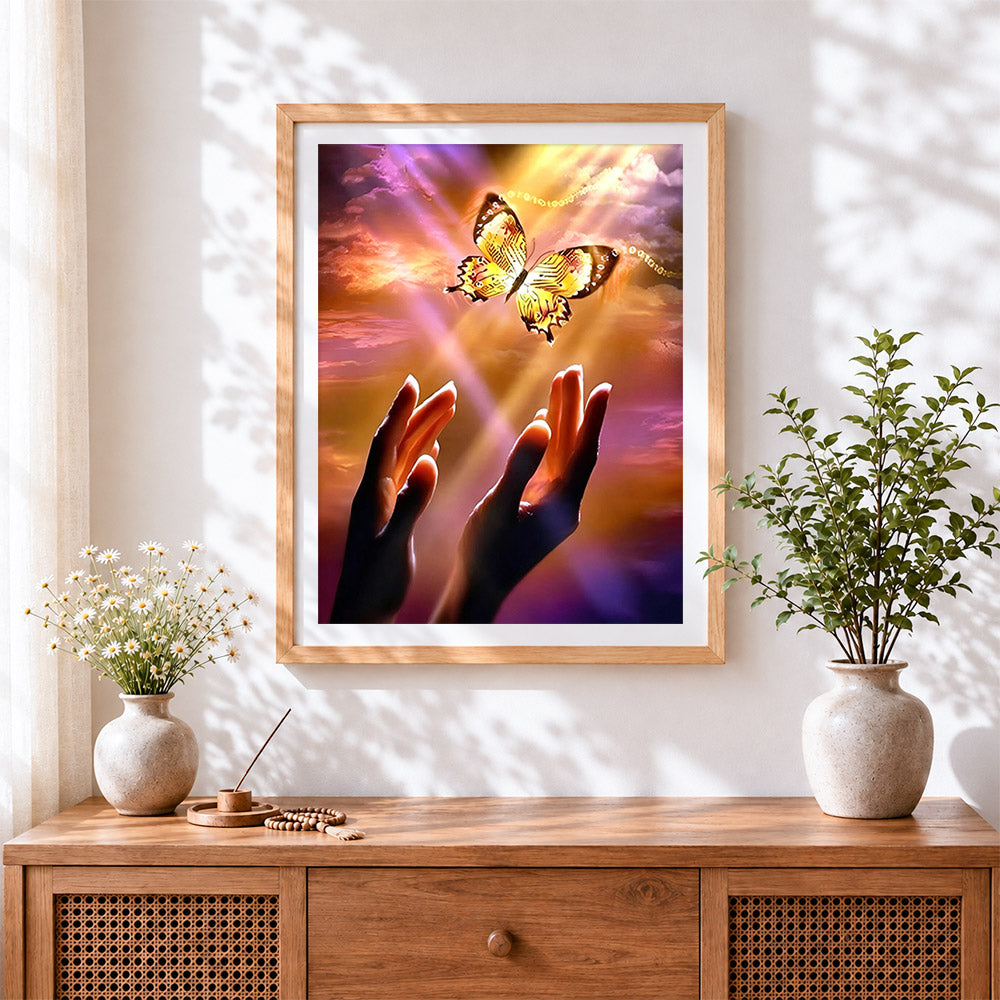 Finished hands releasing a mechanical butterfly cross stitch artwork displayed