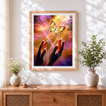 Finished hands releasing a mechanical butterfly cross stitch artwork displayed