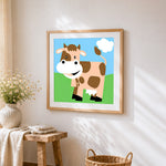 Happy cartoon cow cross stitch artwork displayed on wall as home decor