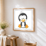 Happy cartoon penguin cross stitch artwork displayed on wall as home decor
