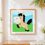 Finished happy cartoon pony cross stitch artwork displayed