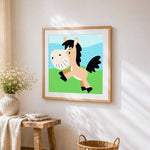 Happy cartoon pony cross stitch artwork displayed on wall as home decor
