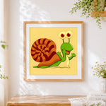 Finished happy cartoon snail cross stitch artwork displayed