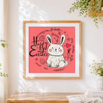 Finished happy easter bunny and carrot cross stitch artwork displayed