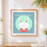 Finished happy easter bunny cross stitch artwork displayed