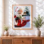 Finished happy father christmas and snowman cross stitch artwork displayed