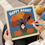 Creating handmade happy haunt tree punch needle artwork