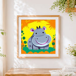 Finished Happy hippo cross stitch artwork displayed