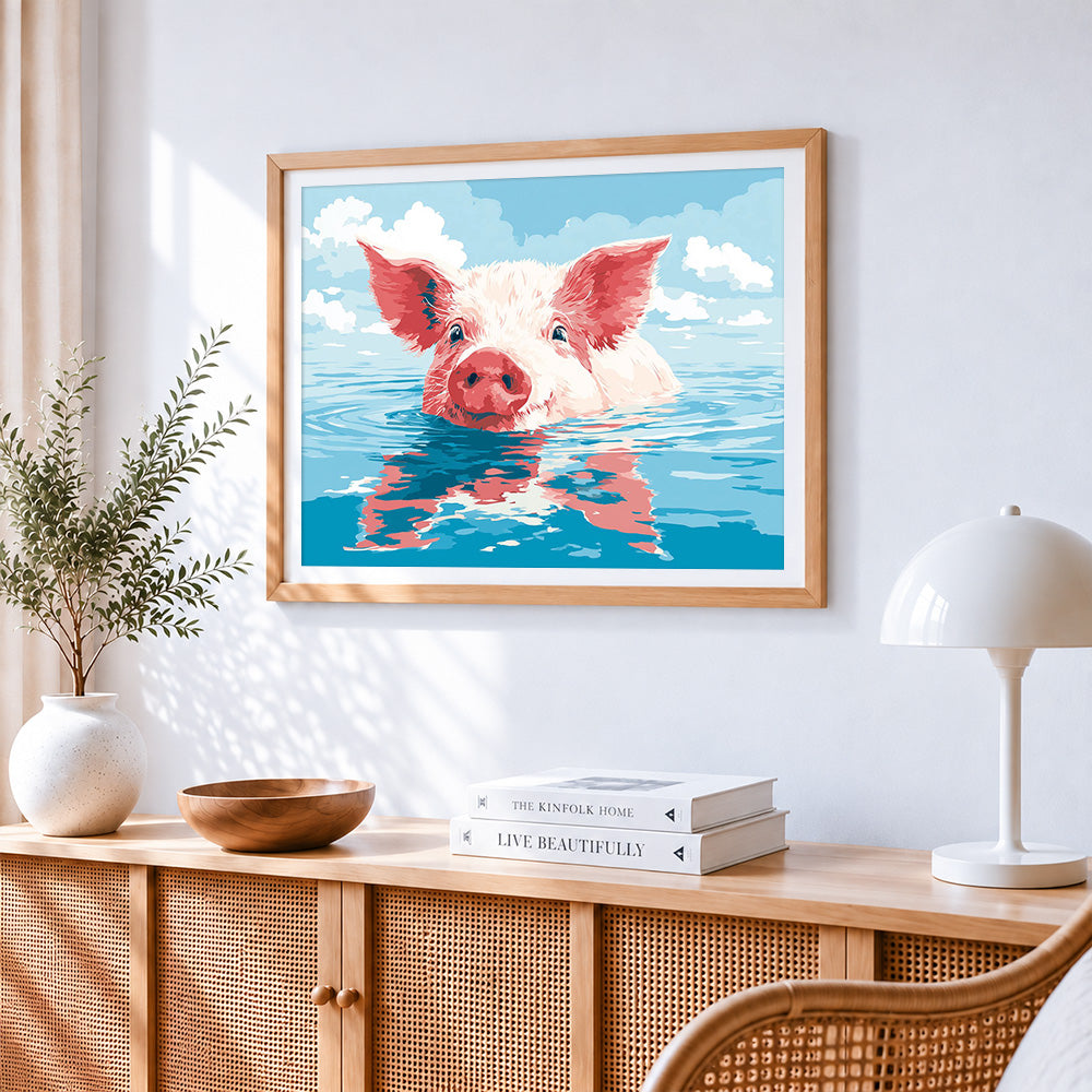 Happy pig swimming in the water cross stitch artwork displayed on wall as home decor