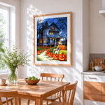 Haunted house and glowing pumpkins paint by numbers artwork displayed on wall as home decor
