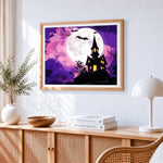 Haunted house on a hill with full moon cross stitch artwork displayed on wall as home decor