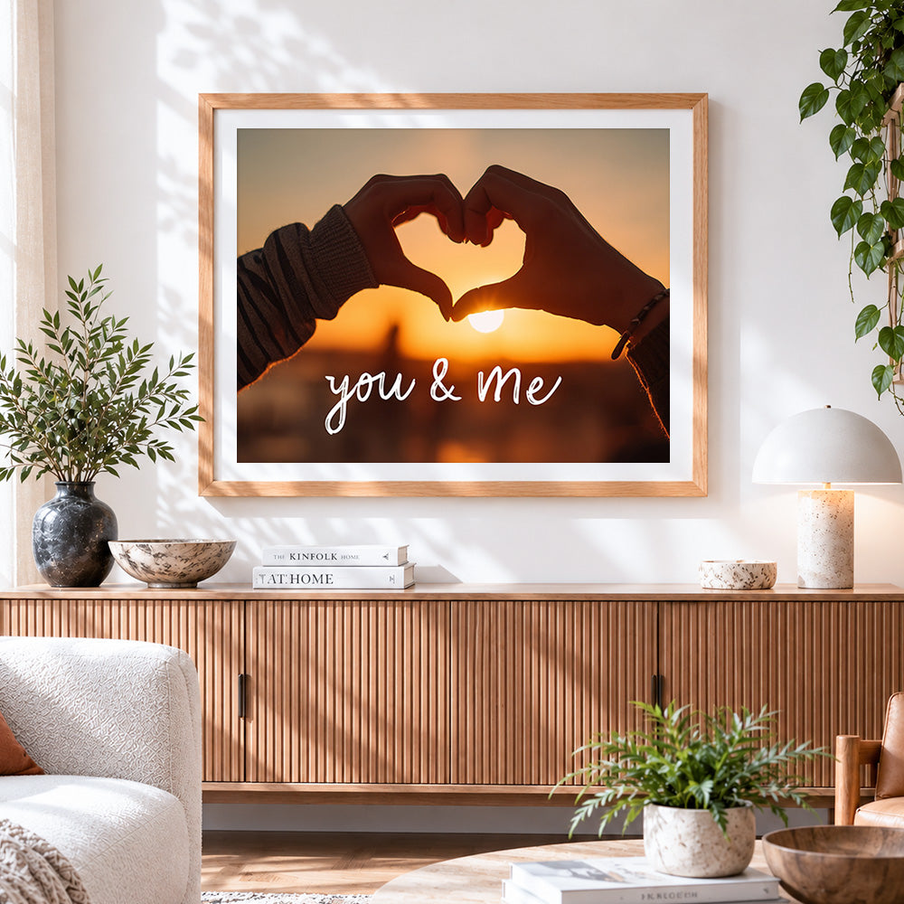 Finished heart hands at sunset cross stitch artwork displayed