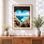 Finished heart shaped cave ocean view cross stitch artwork displayed