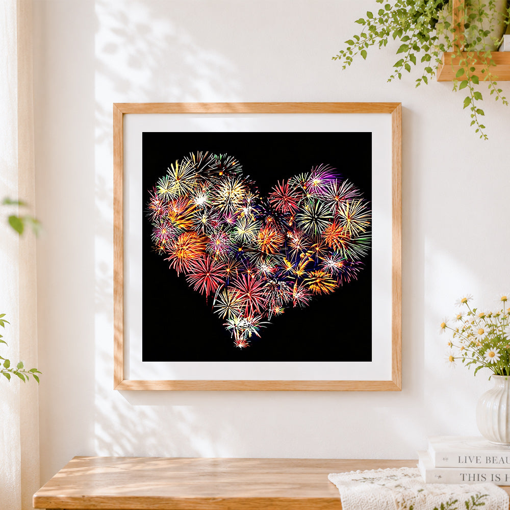 Finished heart shaped fireworks cross stitch artwork displayed