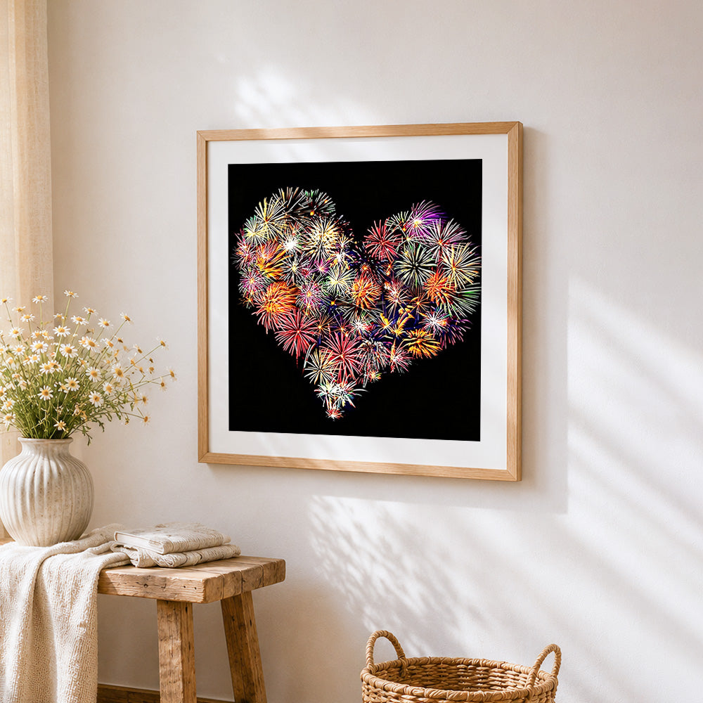 Heart shaped fireworks cross stitch artwork displayed on wall as home decor