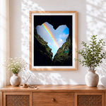Finished heart shaped rainbow in the rocks cross stitch artwork displayed