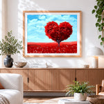Finished heart-shaped red tree cross stitch artwork displayed