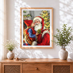 Finished heartwarming child kissing father christmas cross stitch artwork displayed