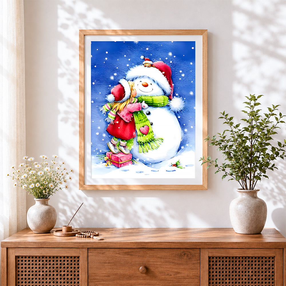 Finished heartwarming girl hugging a snowman cross stitch artwork displayed