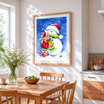 Heartwarming girl hugging a snowman cross stitch artwork displayed on wall as home decor
