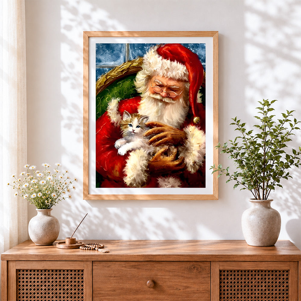 Finished heartwarming santa holding kitten cross stitch artwork displayed