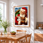 Heartwarming santa holding kitten cross stitch artwork displayed on wall as home decor
