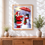 Finished heartwarming santa holding umbrella for a snowman cross stitch artwork displayed
