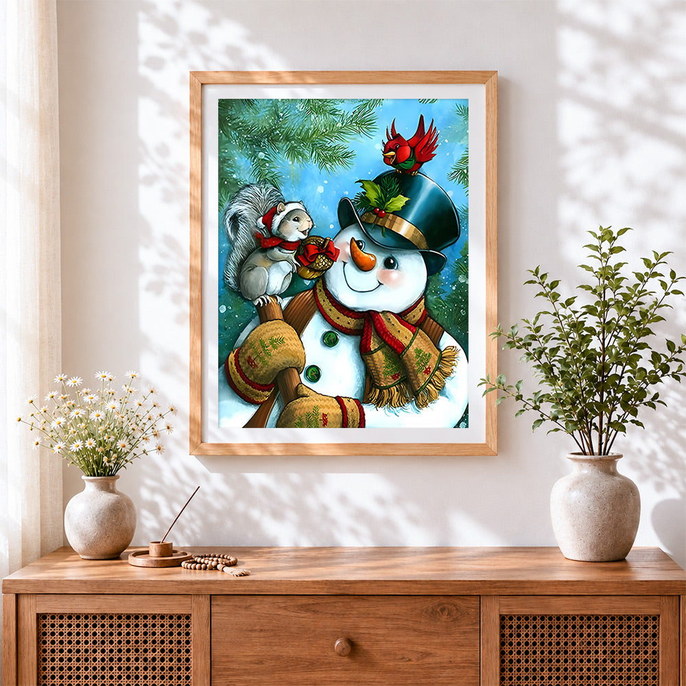 Finished heartwarming snowman and squirrel cross stitch artwork displayed