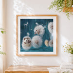 Finished hedgehogs in dandelion fluff cross stitch artwork displayed