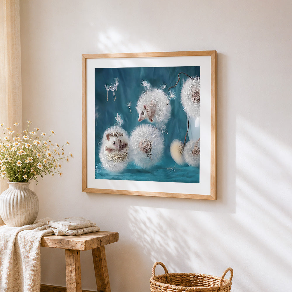 Hedgehogs in dandelion fluff cross stitch artwork displayed on wall as home decor